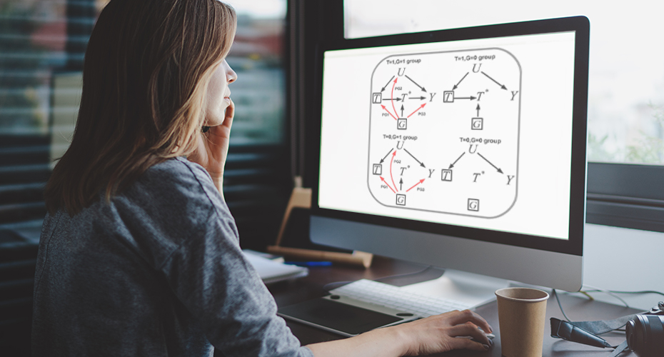 Researcher at computer, using data science research methods